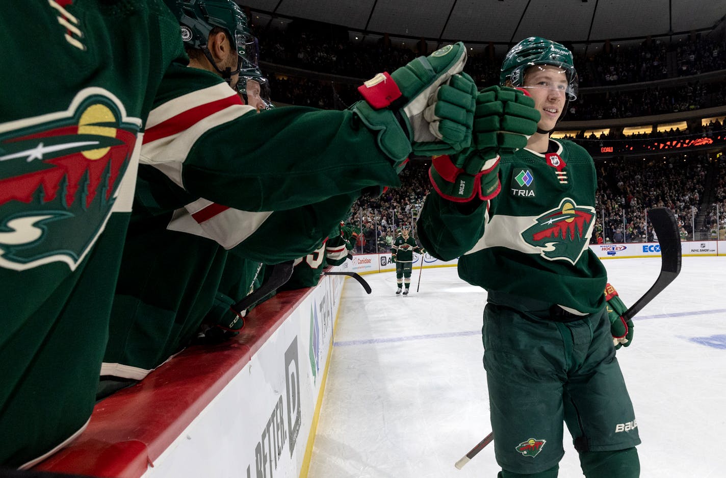 Matt Boldy (12) of the Minnesota Wild celebrates with teammates after scoring a goal in the second period Monday, March 27, 2023, at Xcel Energy Center in St. Paul, Minn. ] CARLOS GONZALEZ • carlos.gonzalez@startribune.com.