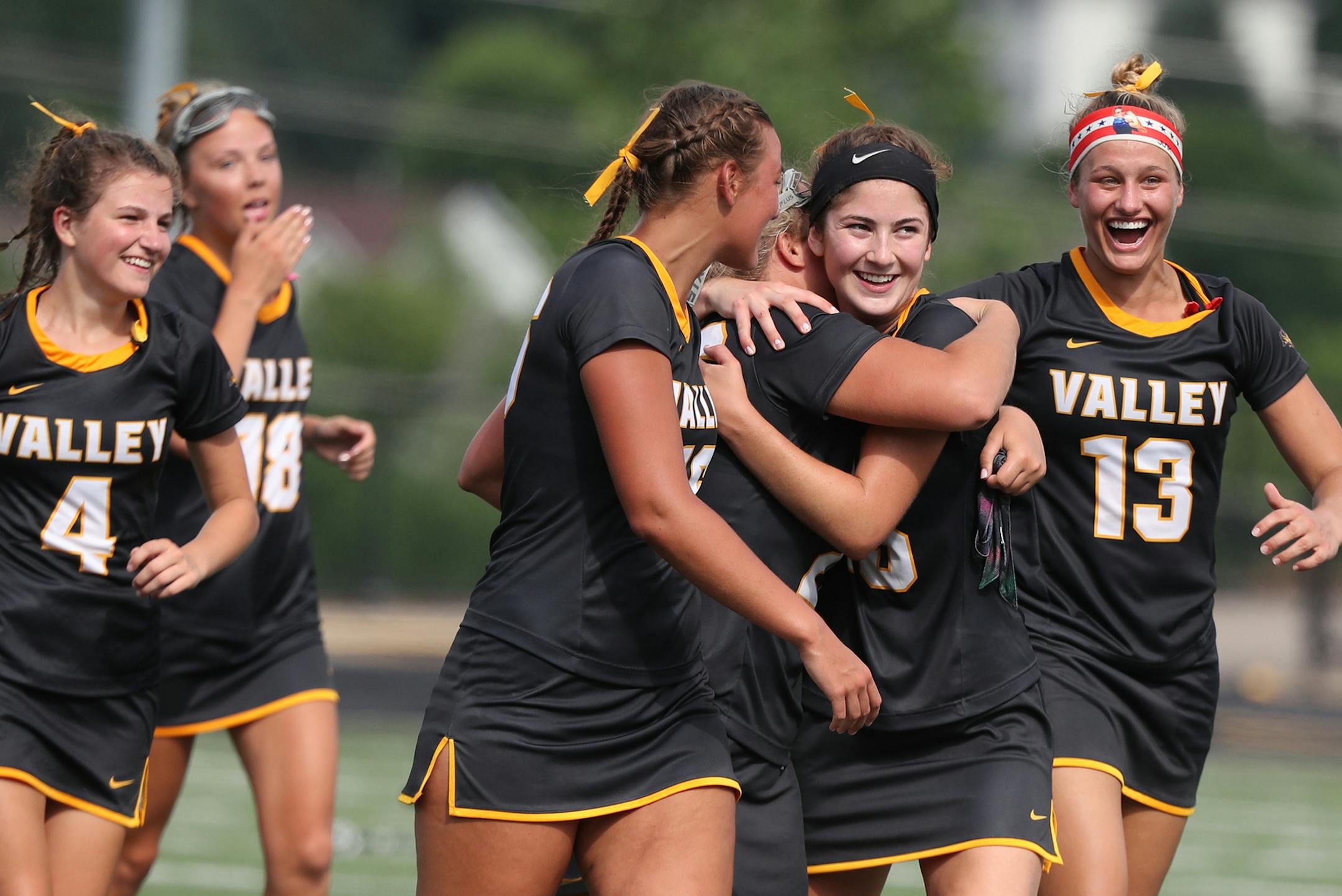 Apple Valley players, including Reagan Roelofs (13) and Taiva Reinertson (4) celebrate their 11-10 win over Eden Prairie during the Minnesota State High School League girls' lacrosse championship at Chanhassen High in Chanhassen, MN.] DAVID JOLES Ô david.joles@startribune.com Apple Valley and Eden Prairie during the first half of the Minnesota State High School League girls' lacrosse championship at Chanhassen High in Chanhassen, MN. ORG XMIT: MIN1806161729180476