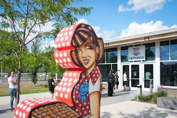 People stand in queue hoping to be chosen to fill one of the remaining 1,200 open Minnesota State Fair positions which need to be filled before the ev