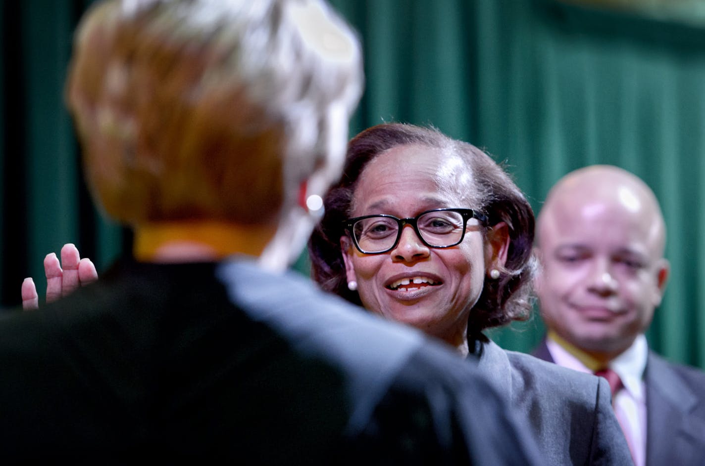 Judge Natalie Hudson is sworn in by Chief Justice Lorie Guldea, left, On the right Hudson's son Kobie Hudson. ] GLEN STUBBE * gstubbe@startribune.com Friday, November 20, 2015 Judge Natalie Hudson was sworn in Friday, becoming the second African-American woman on the Minnesota Supreme Court.