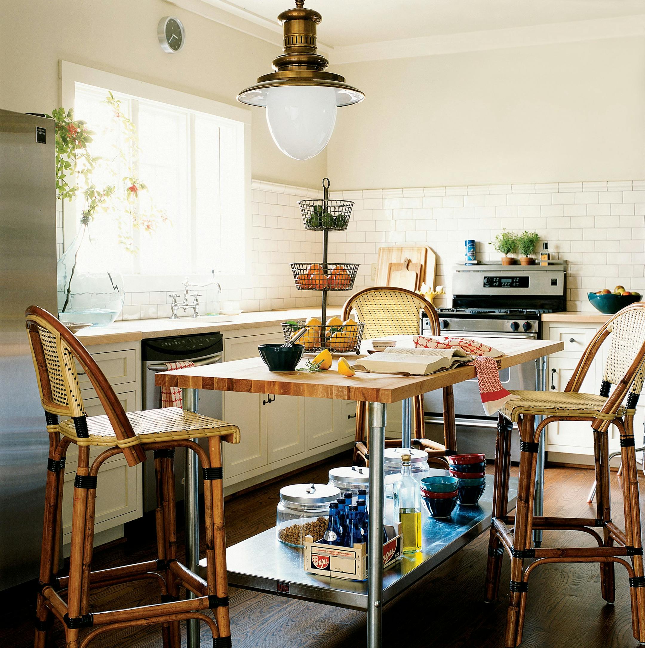 Island + barstool + pendant light + fruit bowl + cookbook + apron = an irresistible kitchen for cooks and company. (Handout/KRT)