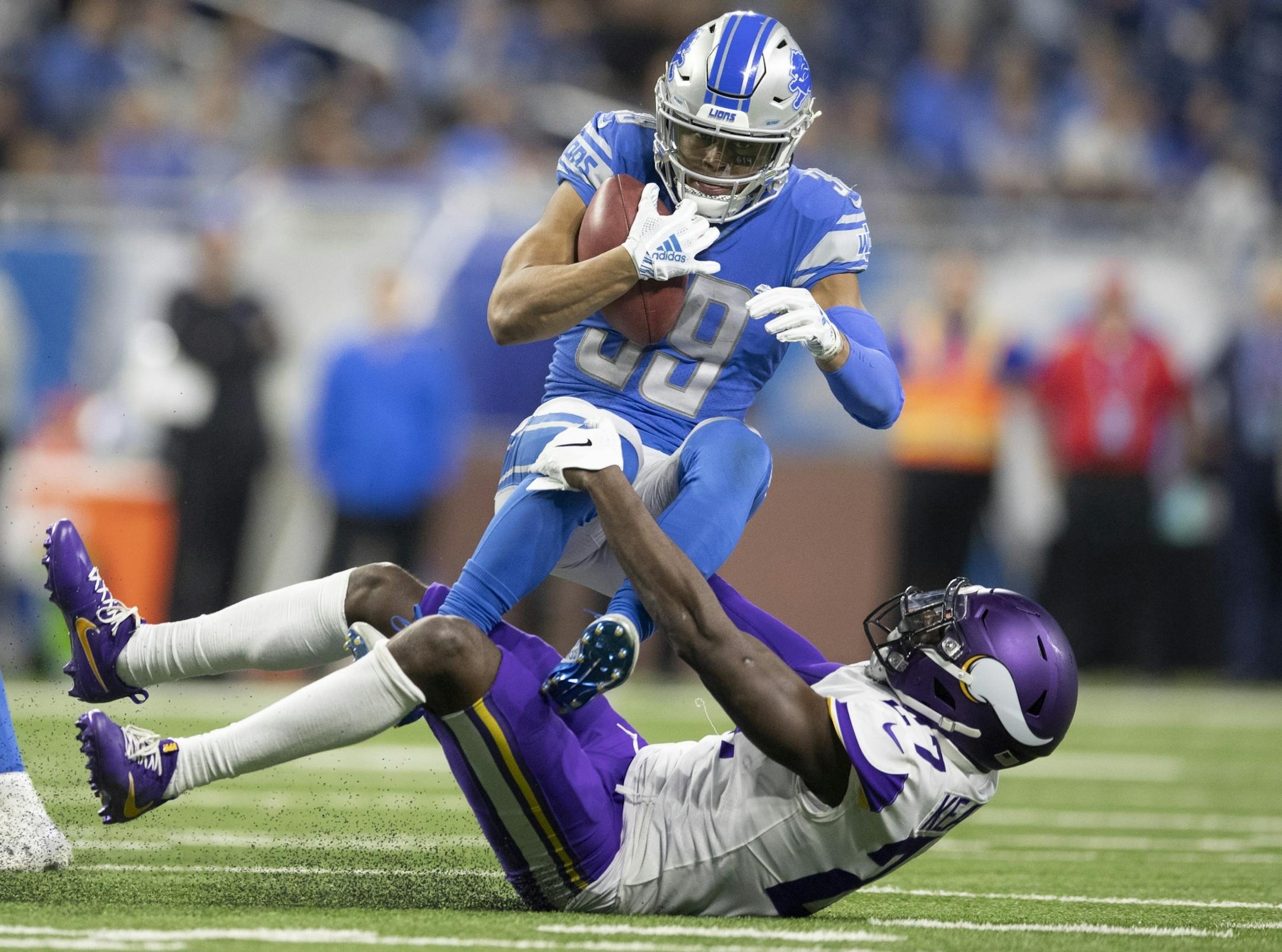 Jamal Agnew (39) was tackled by Minnesota Vikings safety Jayron Kearse (27) on a kick return in the third quarter at Ford Field Sunday December 23, 2018 in Detroit, MI.