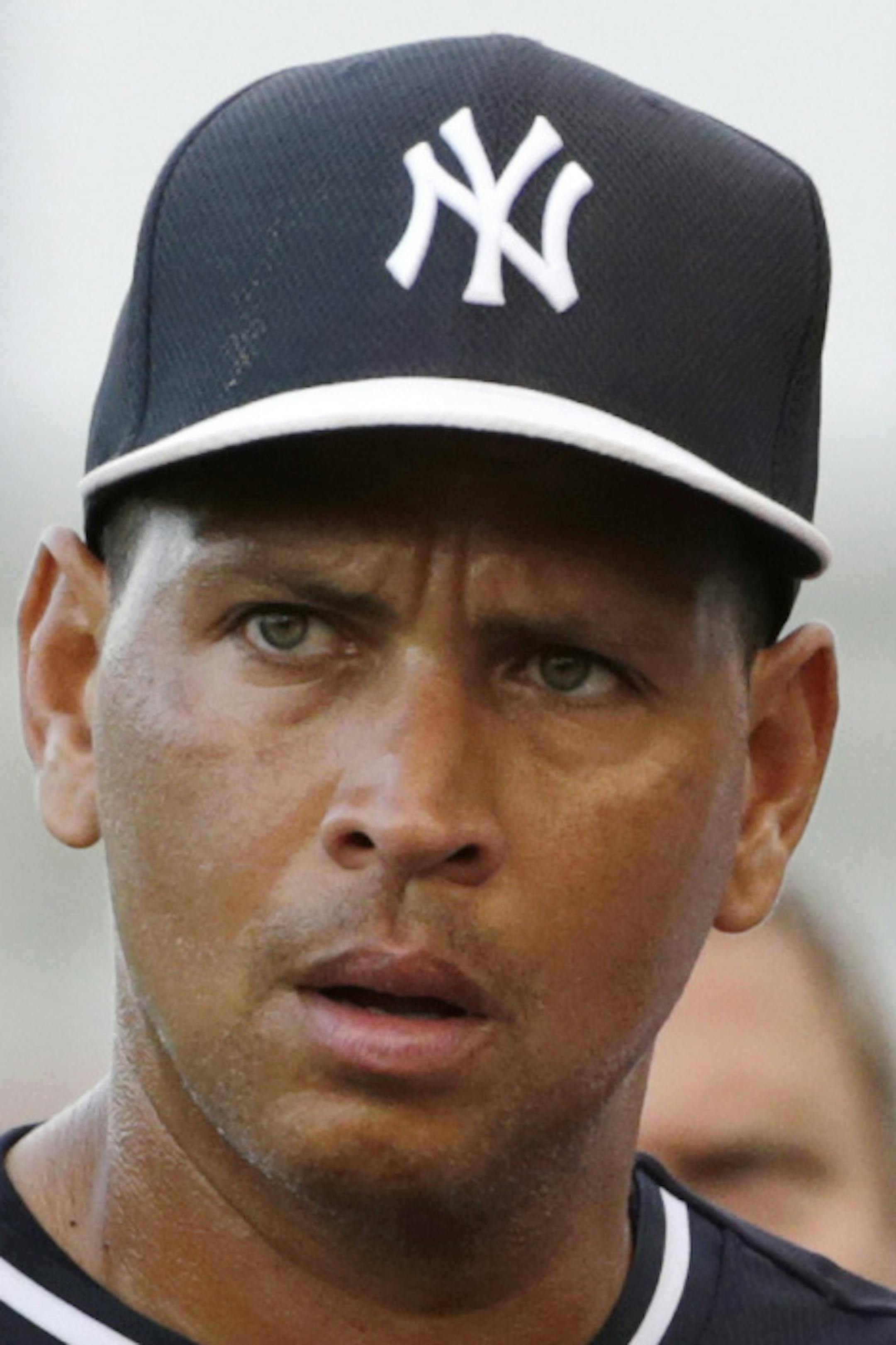 New York Yankees Alex Rodriguez pauses while signing autographs before an exhibition baseball game against the Detroit Tigers in Tampa, Fla., Tuesday, March 24, 2015. (AP Photo/Kathy Willens)