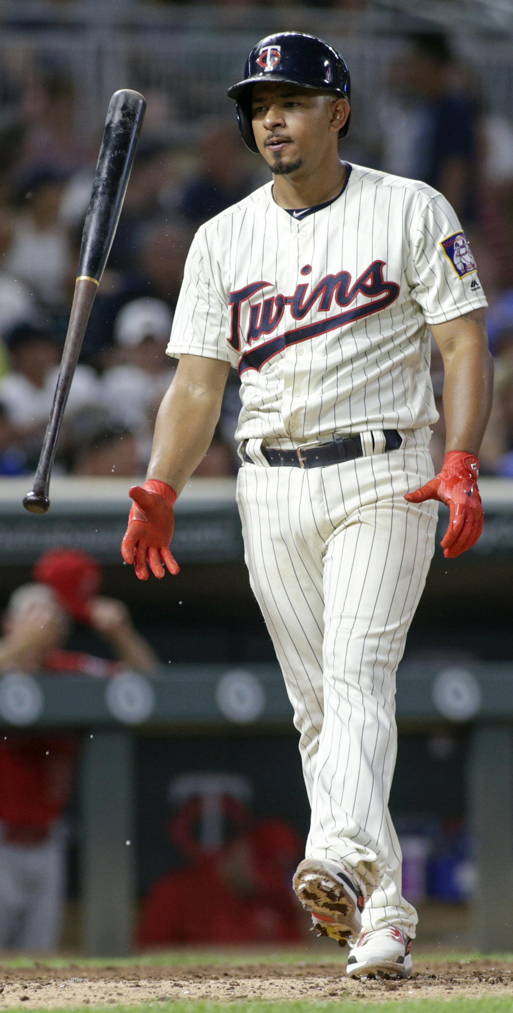 Minnesota Twins' Eduardo Escobar flips his bat after the second strike during his eighth-inning at-bat against the Los Angeles Angels in a baseball game Wednesday, July 5, 2017, in Minneapolis. Escobar flied out on the at-bat. The Angels won 2-1. (AP Photo/Paul Battaglia)