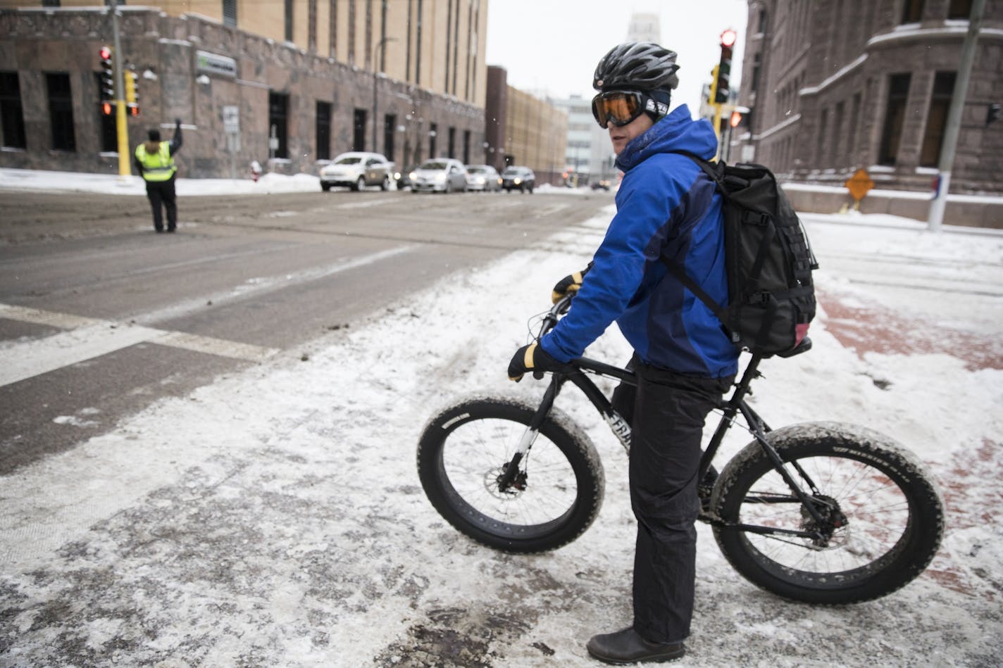 Despite the cold, fat tire bicyclist Brett Schoech rode to work in downtown Minneapolis on Friday morning.