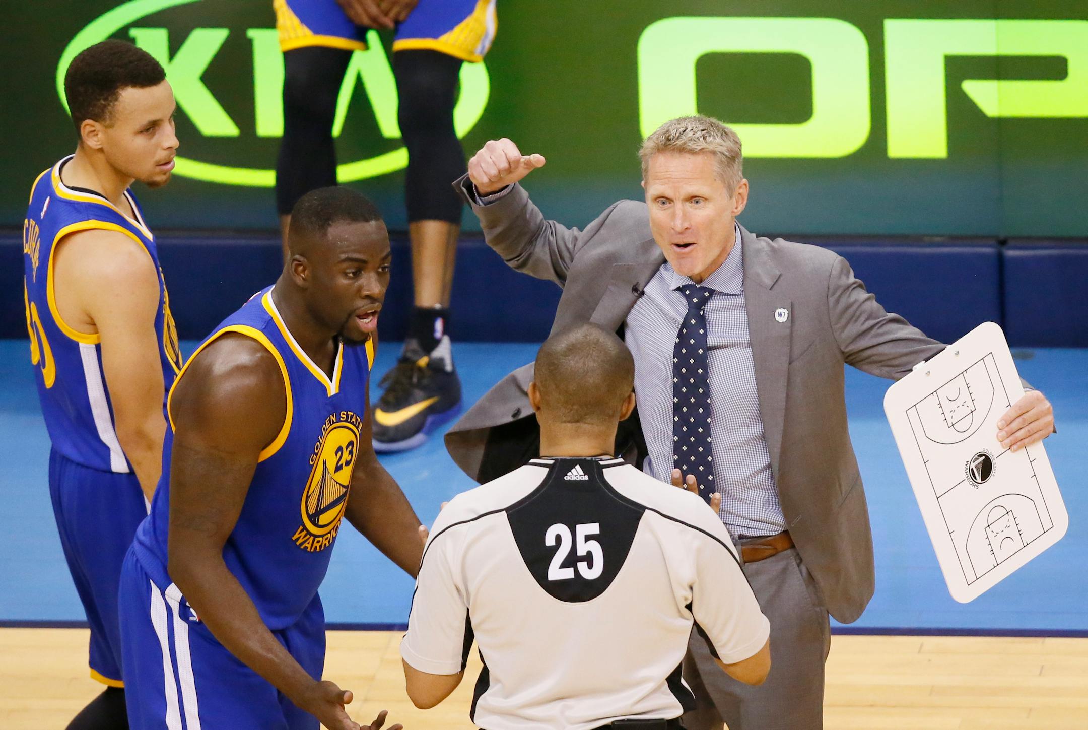 Golden State Warriors head coach Steve Kerr, right, and forward Draymond Green (23) dispute a flagrant foul call on Green in the first half in Game 3 against the Oklahoma City Thunder of the NBA basketball Western Conference finals in Oklahoma City, Sunday, May 22, 2016. (AP Photo/Sue Ogrocki)