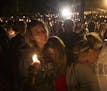 A group of young women console each other during a vigil on Oct. 1, 2015 in Roseburg, Ore. after a shooter opened fire at the Umpqua Community College