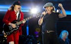 FILE - In a Saturday, Aug. 22, 2015 file photo, AC/DC's Angus Young, left, and Brian Johnson perform during their Rock Or Bust World Tour at Gillette 