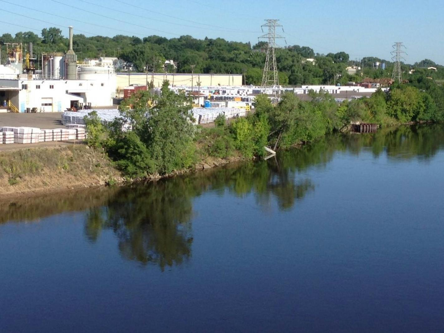 The GAF roofing plant, just upstream from the Lowry Avenue Bridge, makes shingles and stores them on adjacent land it leases from the city of Minneapolis.