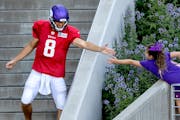 Vikings quarterback Kirk Cousins greeted a fan before a training camp practice last season. 