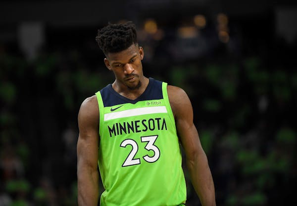 Minnesota Timberwolves guard Jimmy Butler (23) looked on in frustration after the Phoenix Suns cut the Wolves' lead down to one possession in the four