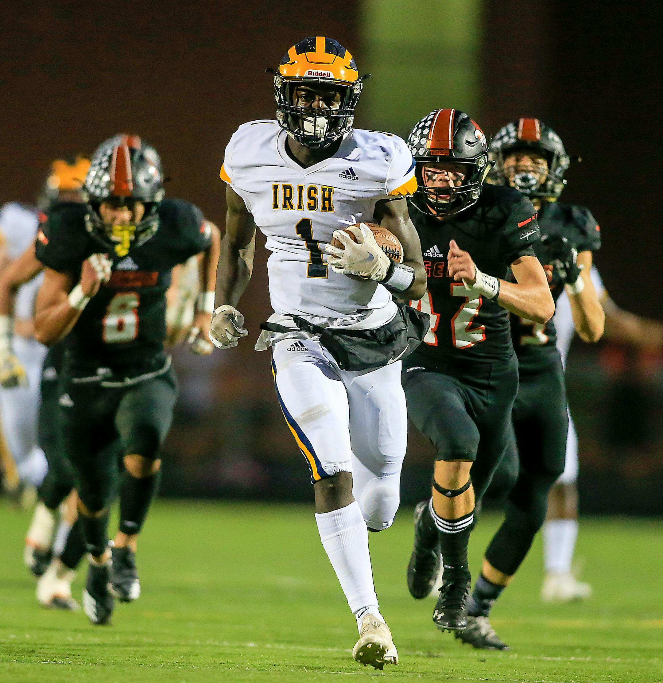Rosemount receiver Jonathan Mann (1) grabbed a short pass over the middle and ran 50-plus yards for a touchdown on the second play of the second quarter. Photo by Mark Hvidsten, SportsEngine