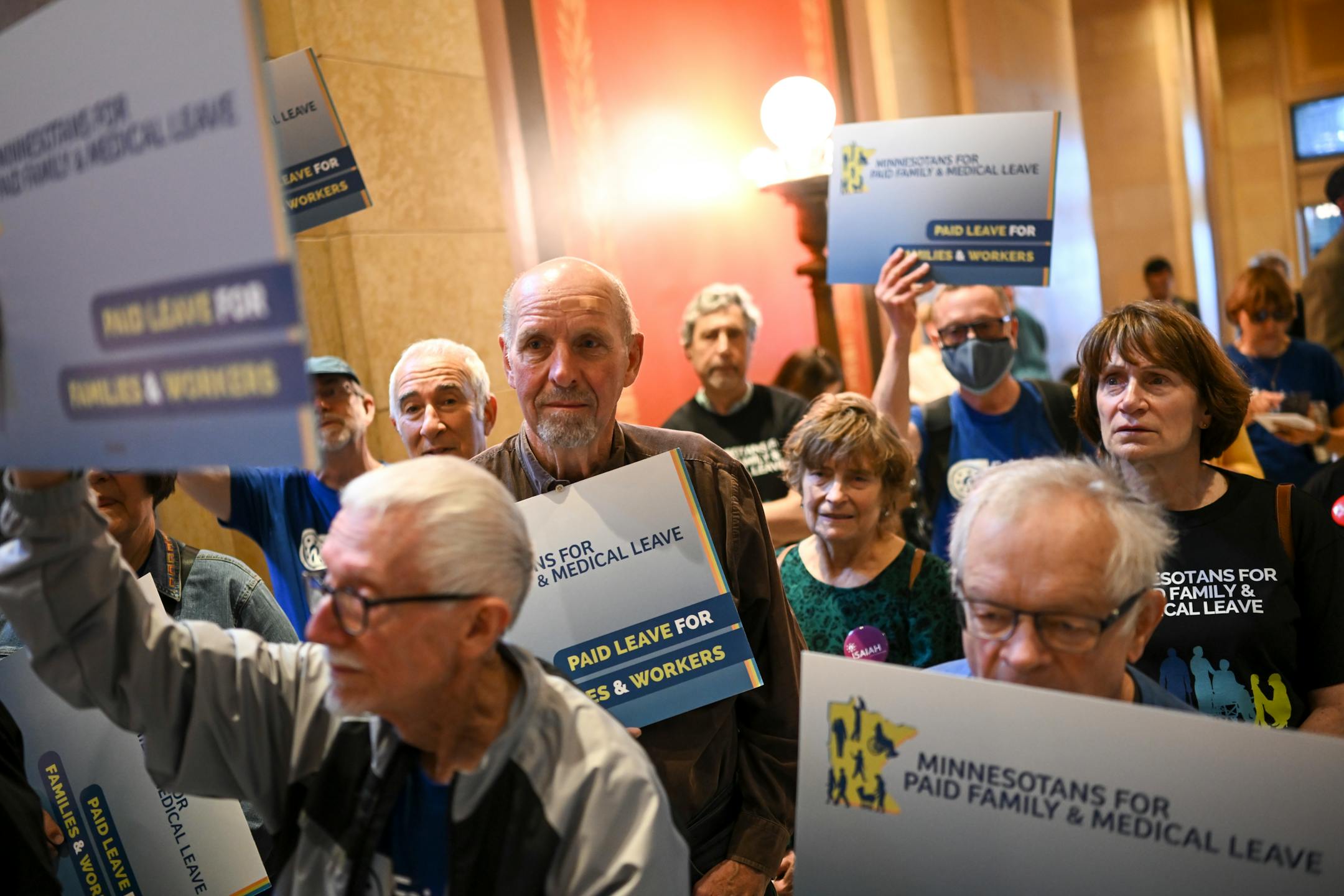 Paid family leave advocates gather for a rally at the Minnesota State Capitol Monday.