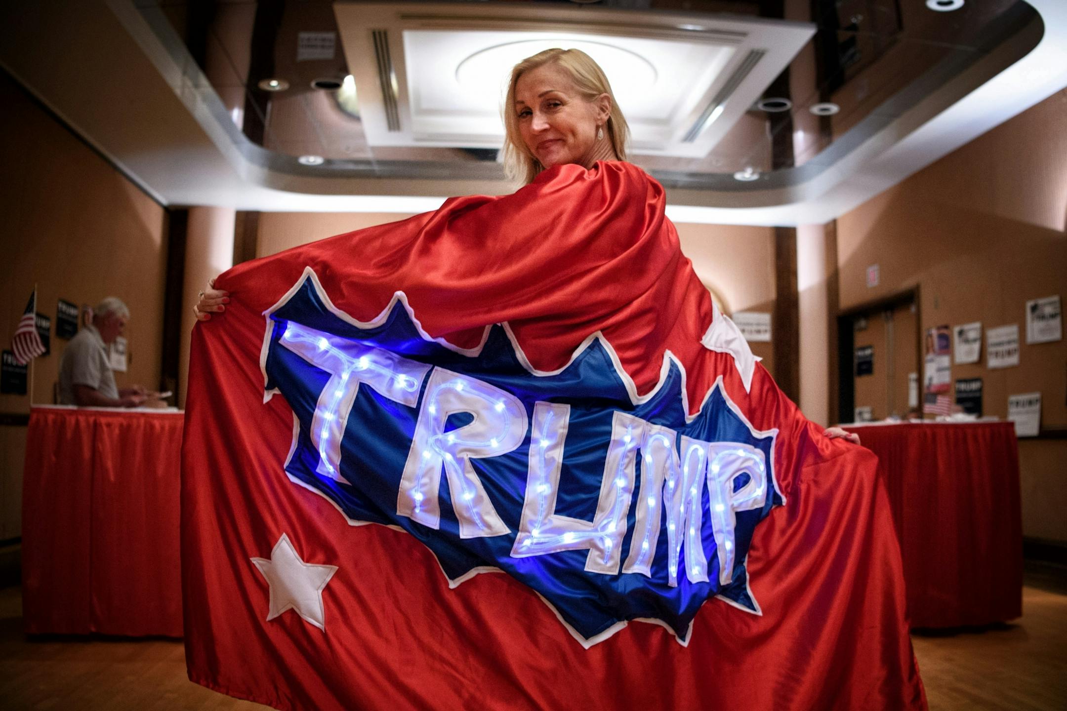 GOP state delegate and Trump supporter Mary Susan of Chanhassen, showed off her Trump superhero cape.