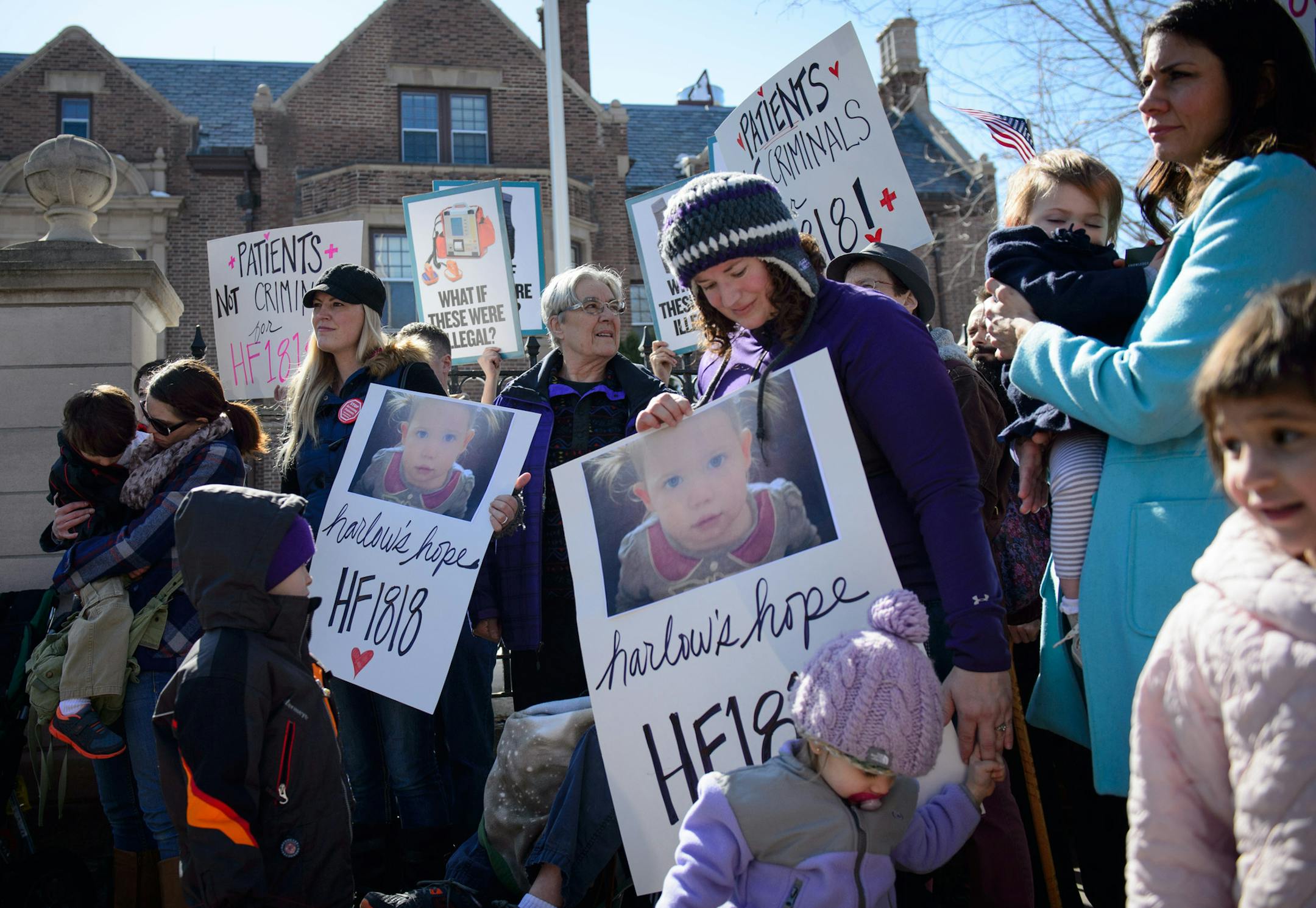 A group of medical marijuana patients and advocates gathered in front of the Minnesota Governor's Residence to deliver a greeting card to Gov. Mark Dayton, who is recovering from hip surgery. A group of 11 met with the Governor in the residence. ] GLEN STUBBE * gstubbe@startribune.com Thursday, March 13, March 10, 2014.