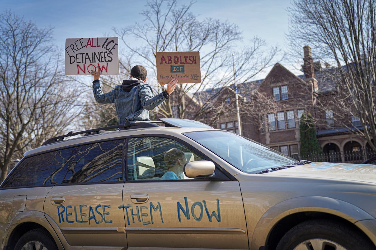 Activists honked horns March 27 outside the Governor's Residence in St Paul, calling for the release of high-risk prisoners and ICE detainees.