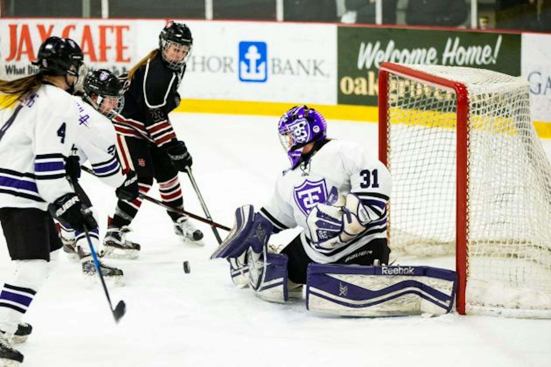 Hamline's Bre Simon (20) takes a shot against St. Thomas goalie Kenzie Torpy during the Tommies' 3-2 win on Feb. 15. Simon, the leading scorer in NCAA Division III, faces Torpy, who has a 0.92 goals-against average, when the Pipers and Tommies meet in the Frozen Four semifinals on Friday at St. Thomas Ice Arena in Mendota Heights