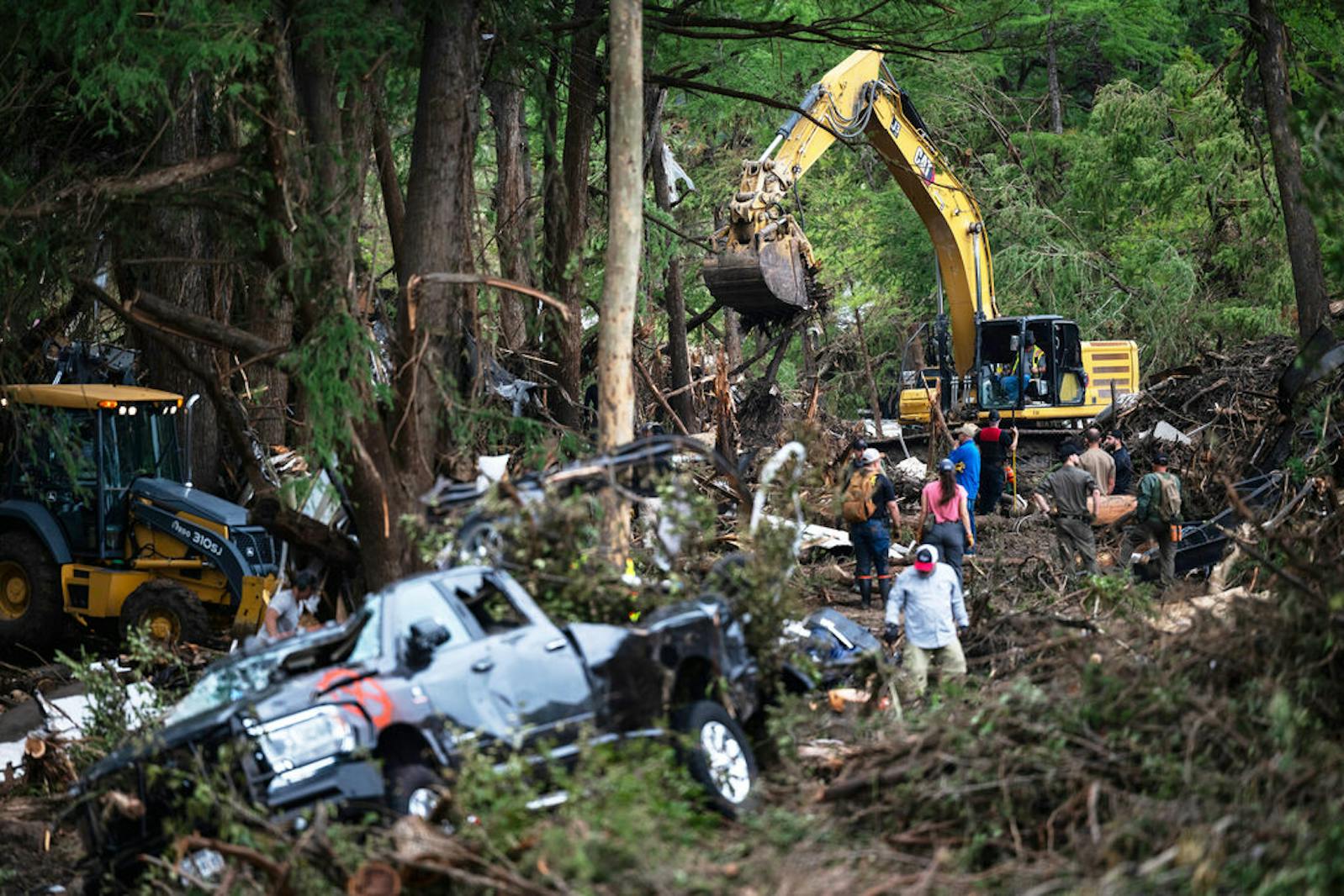 First responders carry out search and rescue operations near the Guadalupe River after a flash flood swept through the area, Monday, July 7, 2025, in Ingram, Texas. (AP Photo/Eli Hartman)