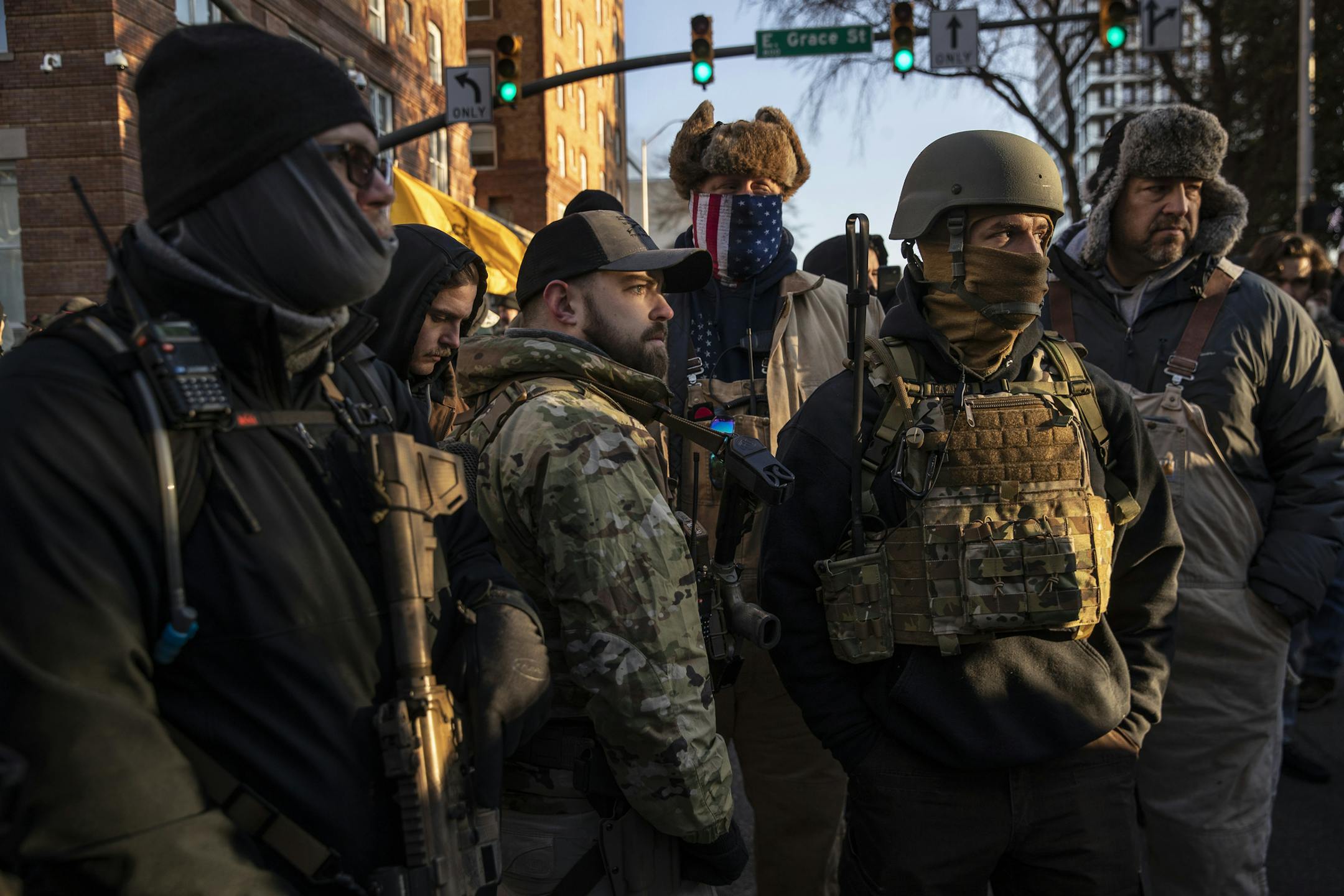 Gun rights advocates carry weapons outside the secure perimeter of the Capitol in Richmond, Va. on Monday, Jan. 20, 2019, where people rallied over gun-control measures making their way through the state Legislature. (Victor J. Blue/The New York Times)