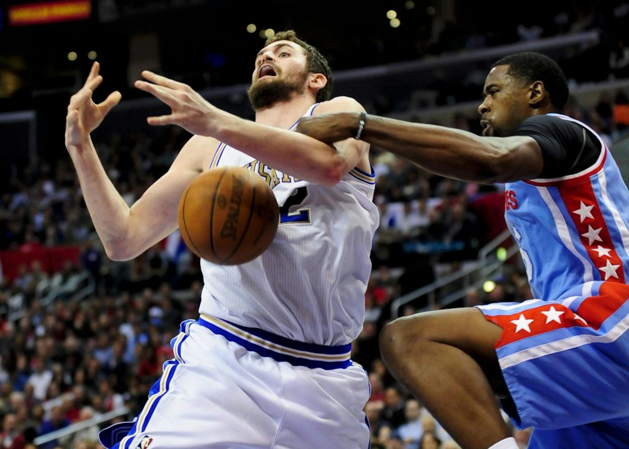 Los Angeles Clippers center DeAndre Jordan, right, strips the ball from Minnesota Timberwolves forward Kevin Love, left, in the first half of an NBA basketball game, Tuesday, Feb. 28, 2012, in Los Angeles.