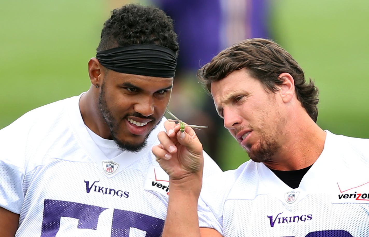 Chad Greenway right showed Anthony Barr a dragon fly during Vikings training camp at Minnesota State University Tuesday July 28, 2015 in Mankato, MN. ] Jerry Holt/ Jerry.Holt@Startribune.com