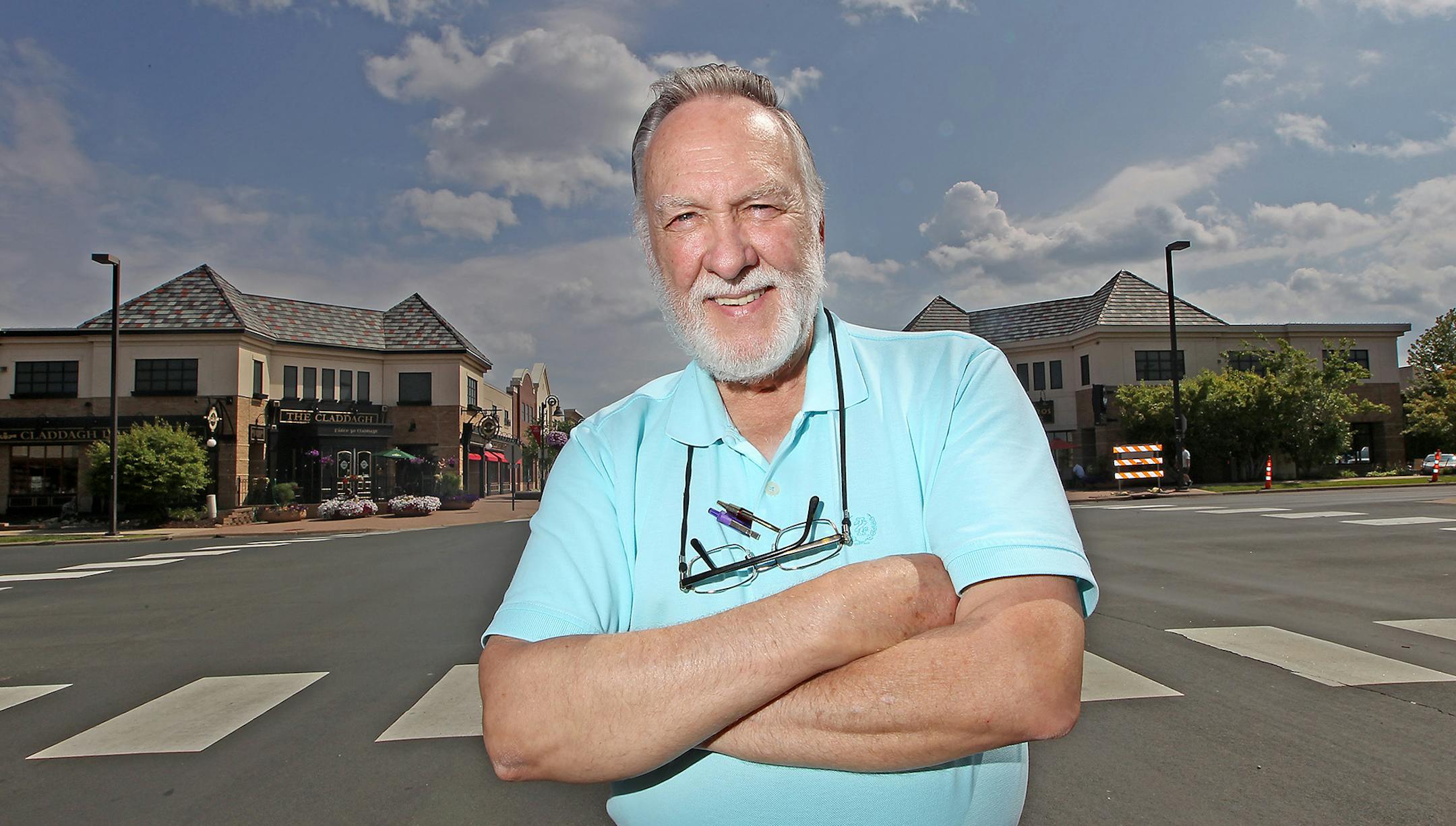 Outgoing Maple Grove City Administrator Al Madsen stood on the street he helped develop.