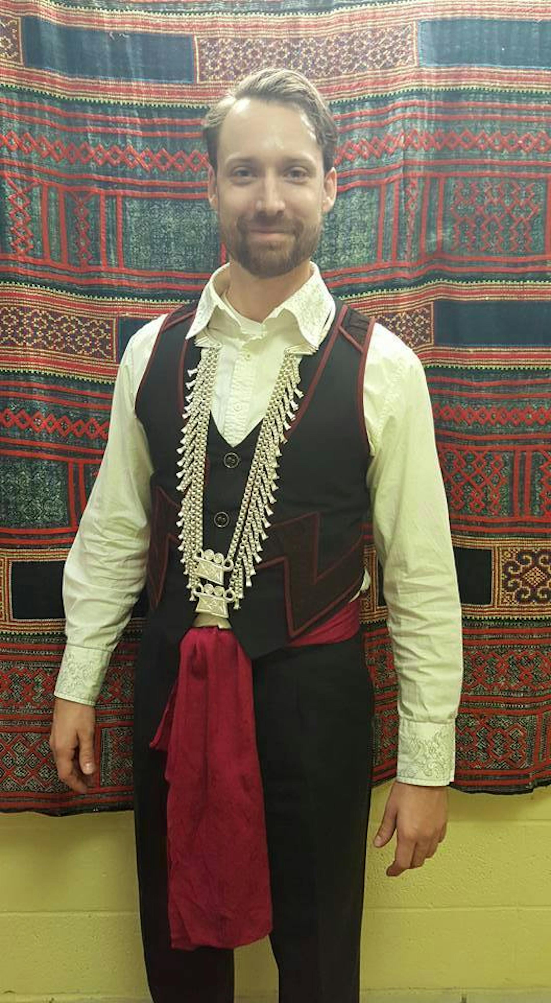 The author in his Hmong vest and necklace, worn for cultural celebrations when he worked at a Hmong-focused charter school in St. Paul, Community School of Excellence.