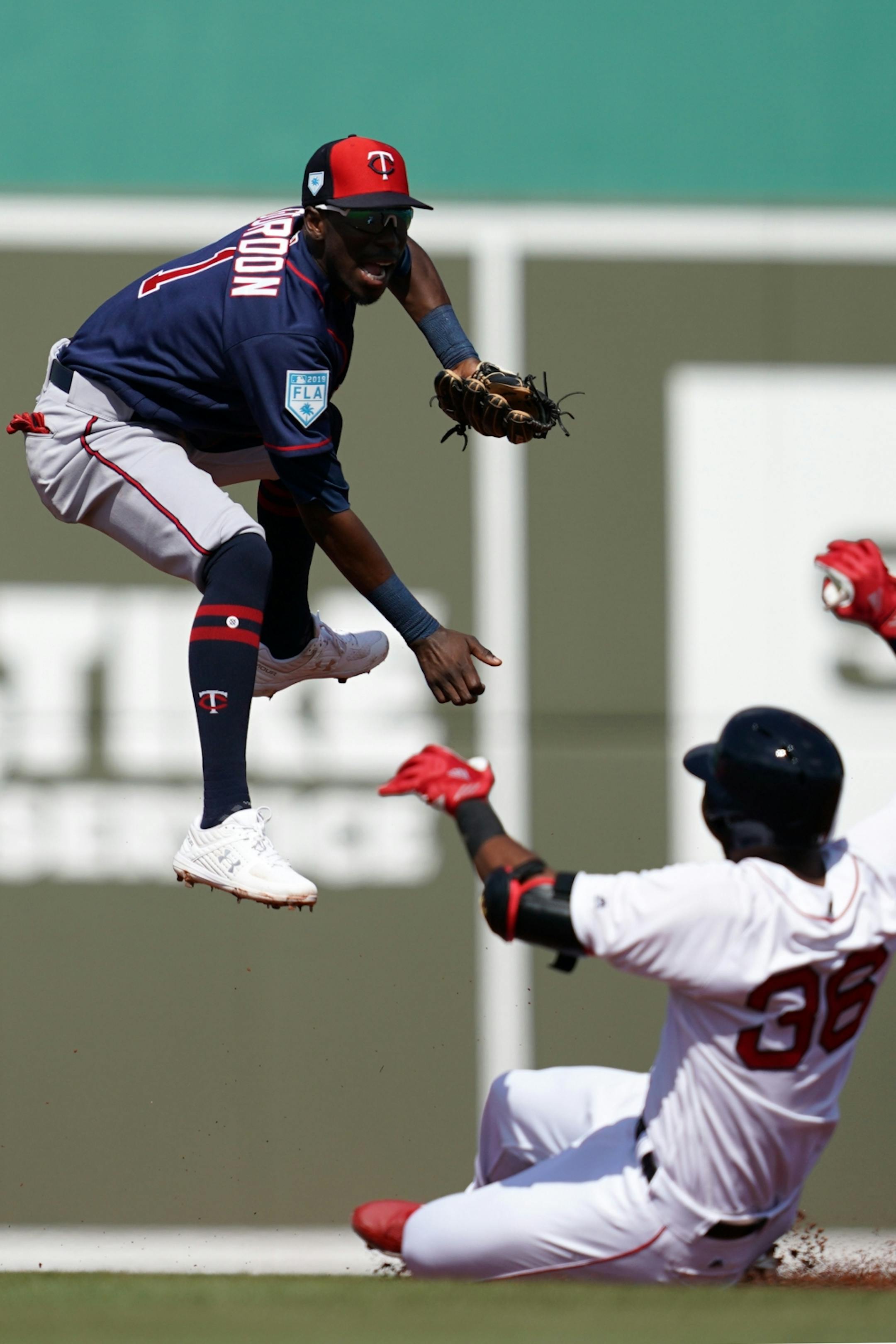 Minnesota Twins shortstop Nick Gordon (1) tried unsuccessfully to tag out Boston Red Sox designated hitter Eduardo Nunez (36) at second after leaping up to make the catch on a throw from left field during Sunday's game.