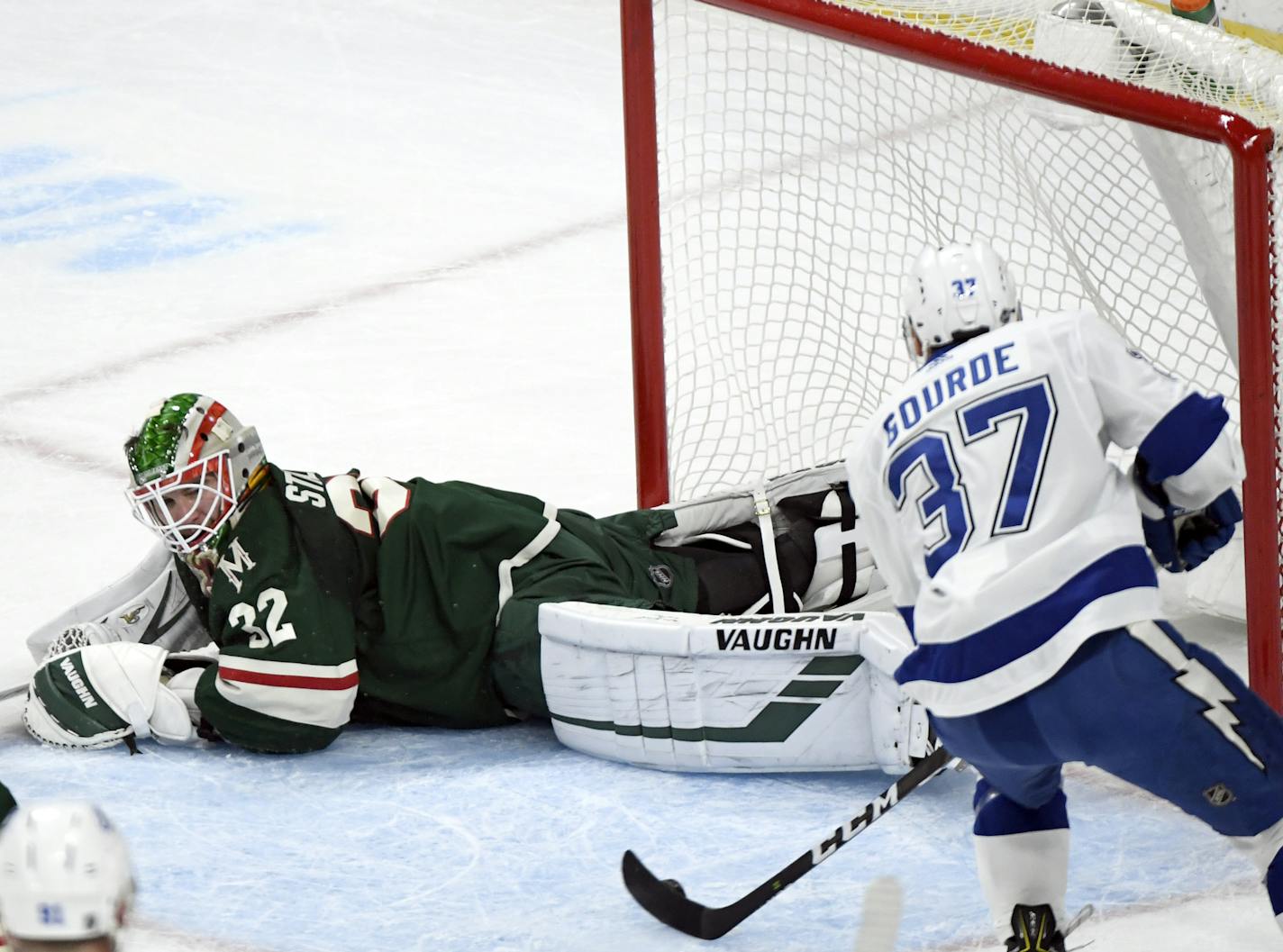 Tampa Bay Lightning's Yanni Gourde (37) scores a goal against Minnesota Wild goaltender Alex Stalock (32) in the first period of an NHL hockey game Saturday, Oct. 20, 2018, in St. Paul, Minn. (AP Photo/Hannah Foslien) ORG XMIT: MIN2018102022021533