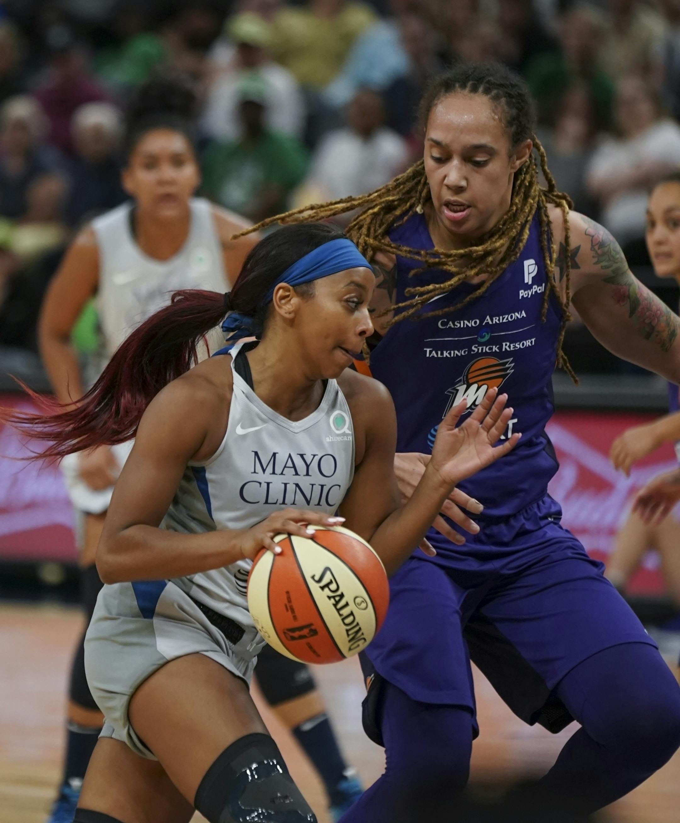 Minnesota Lynx guard Odyssey Sims drove against Phoenix Mercury center Brittney Griner (42) in the third quarter.