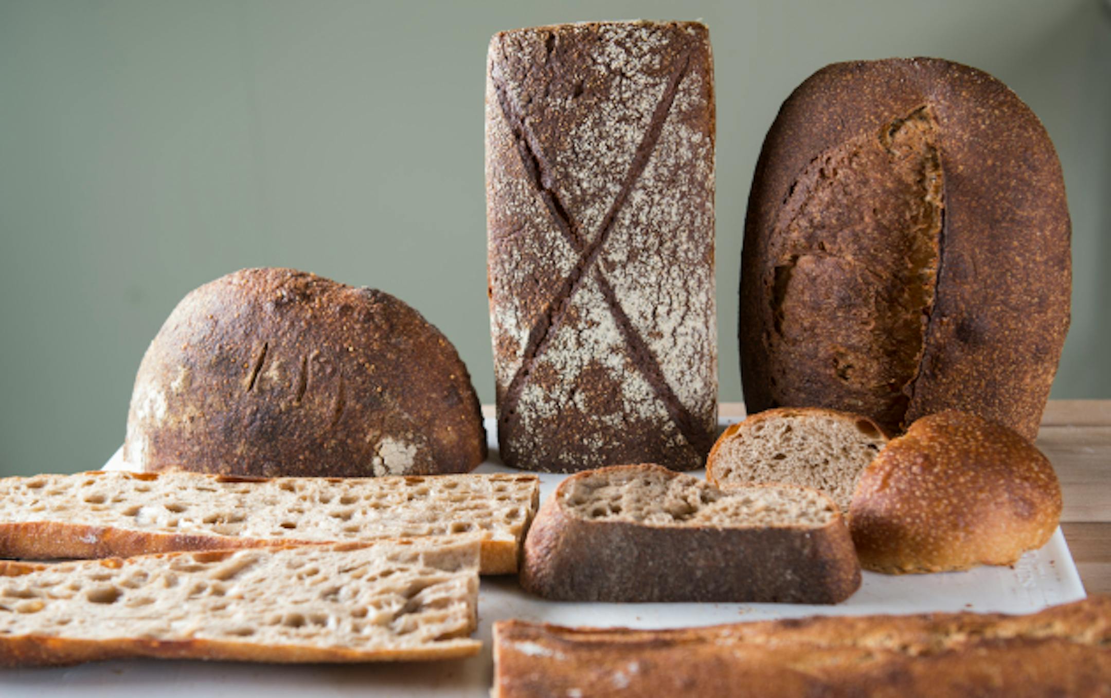 An assortment of breads from Steve Horton's bakery on Thursday.    ]     Isaac Hale ' isaac.hale@startribune.com  Steve Horton creates bread from old tried-and-true methods. He mills his own flour using an on-site mill, and bakes bread using a wood fire deck oven. He stood for a portrait and showed some of his breads at his bakery at 1401 Marshall St. NE. on Thursday, July 28, 2016.