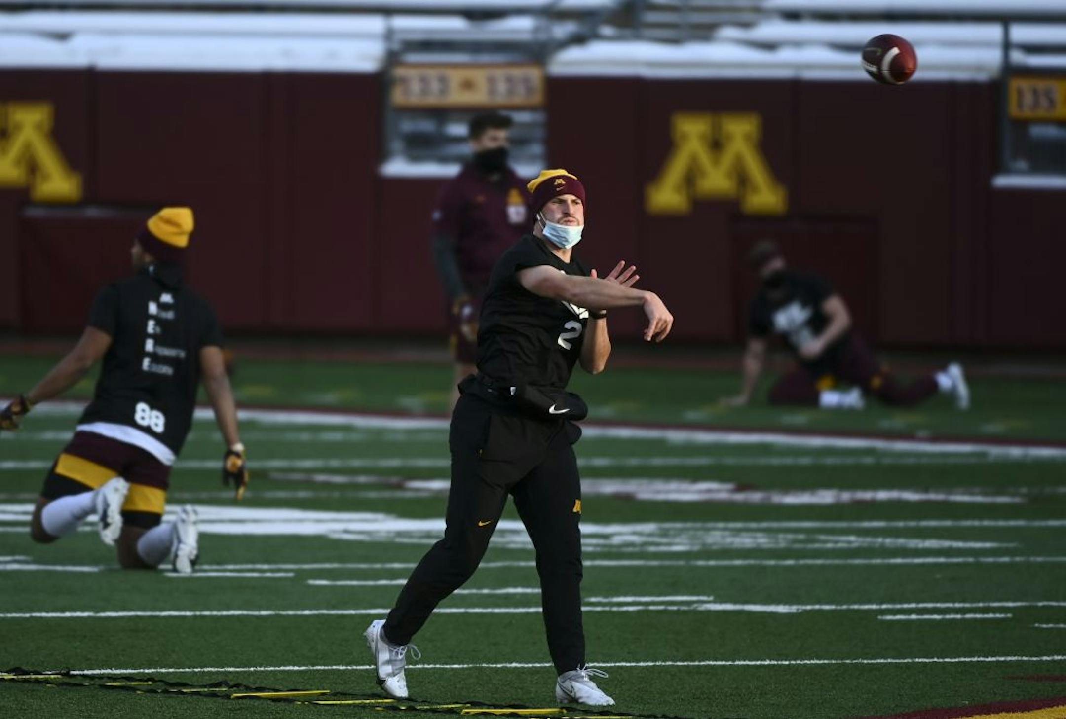 Gophers quarterback Tanner Morgan warmed up on the field before the Iowa game.