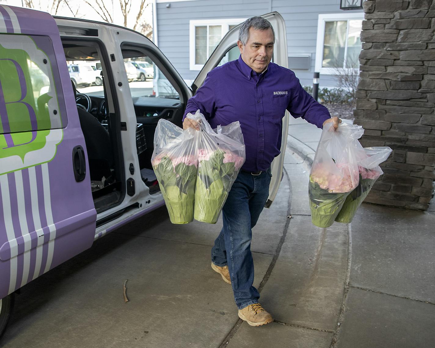 Charles Mathison, of Bachman&#x2019;s, delivered and donated flowers that were to be used for the Galleria 2020 Floral Experience to The Waters&#x2019; senior home, Friday, March 20, 2020 in Minneapolis, MN. The Galleria 2020 Floral Experience was supposed to run from Mar. 29 to April 12, and would have featured 4,000 brightly-colored flowers set up throughout the Galleria&#x2019;s public spaces. This year&#x2019;s event theme was intended to be &#x201c;Sugar Coated." ] ELIZABETH FLORES &#x2022;