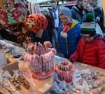 Candy canes and plastic cones filled with candies draw customers to a vendor&#x2019;s booth at the Gendarmenmarkt Christmas market in Berlin, 2016. Ph