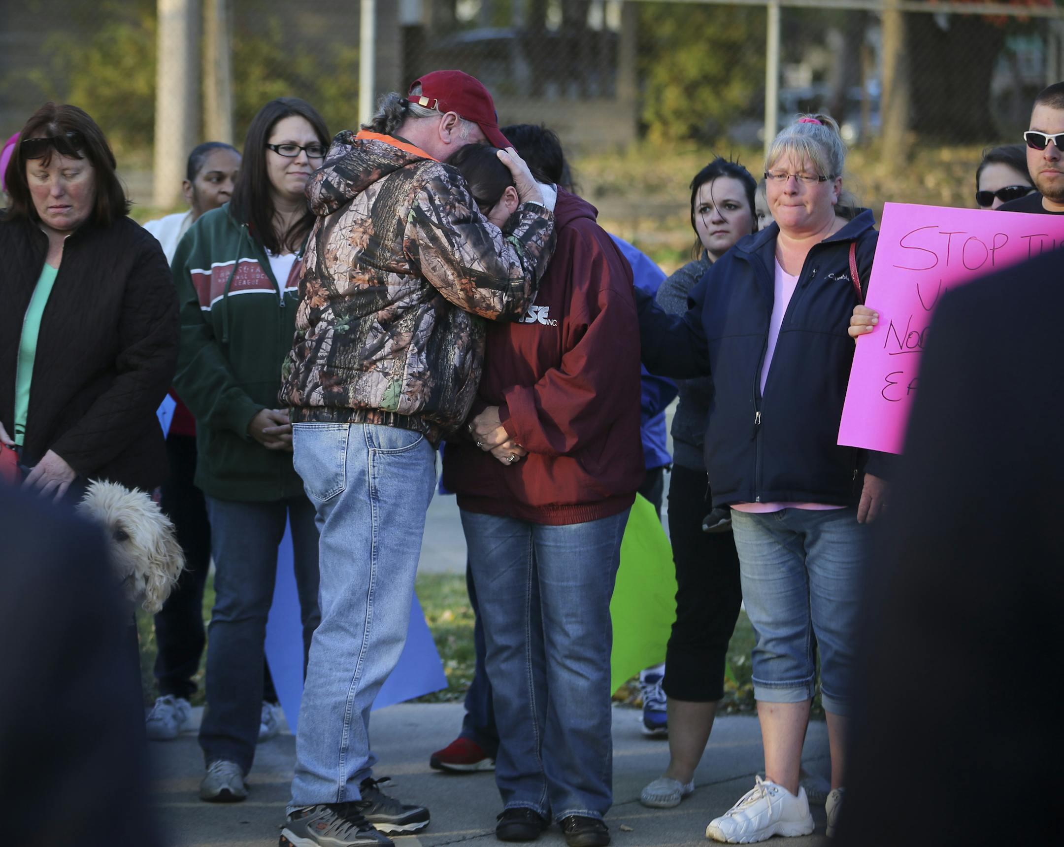 Terry Zietlow hugged Julie Zietlow, who is the mother of Sarah Wierstad, who was killed in a shooting recently, during a peace march after a run of shooting deaths in the east side in St. Paul, Minn., on Wednesday, October 21, 2015. ] RENEE JONES SCHNEIDER &#x2022; reneejones@startribune.com I think he is her husband