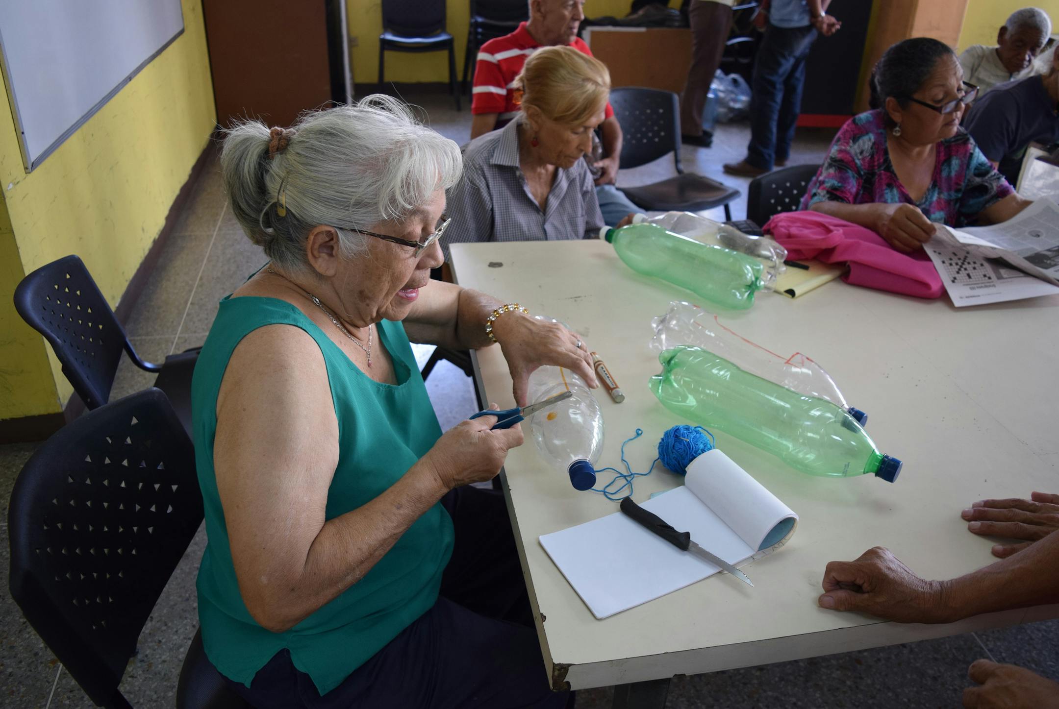 Senior citizens in Caracas, Venezuela, get a lesson on urban agriculture. As the nation finds itself in a food crisis, the government is urging city-dwellers to plant fruits and vegetables. (Jim Wyss/Miami Herald/TNS)