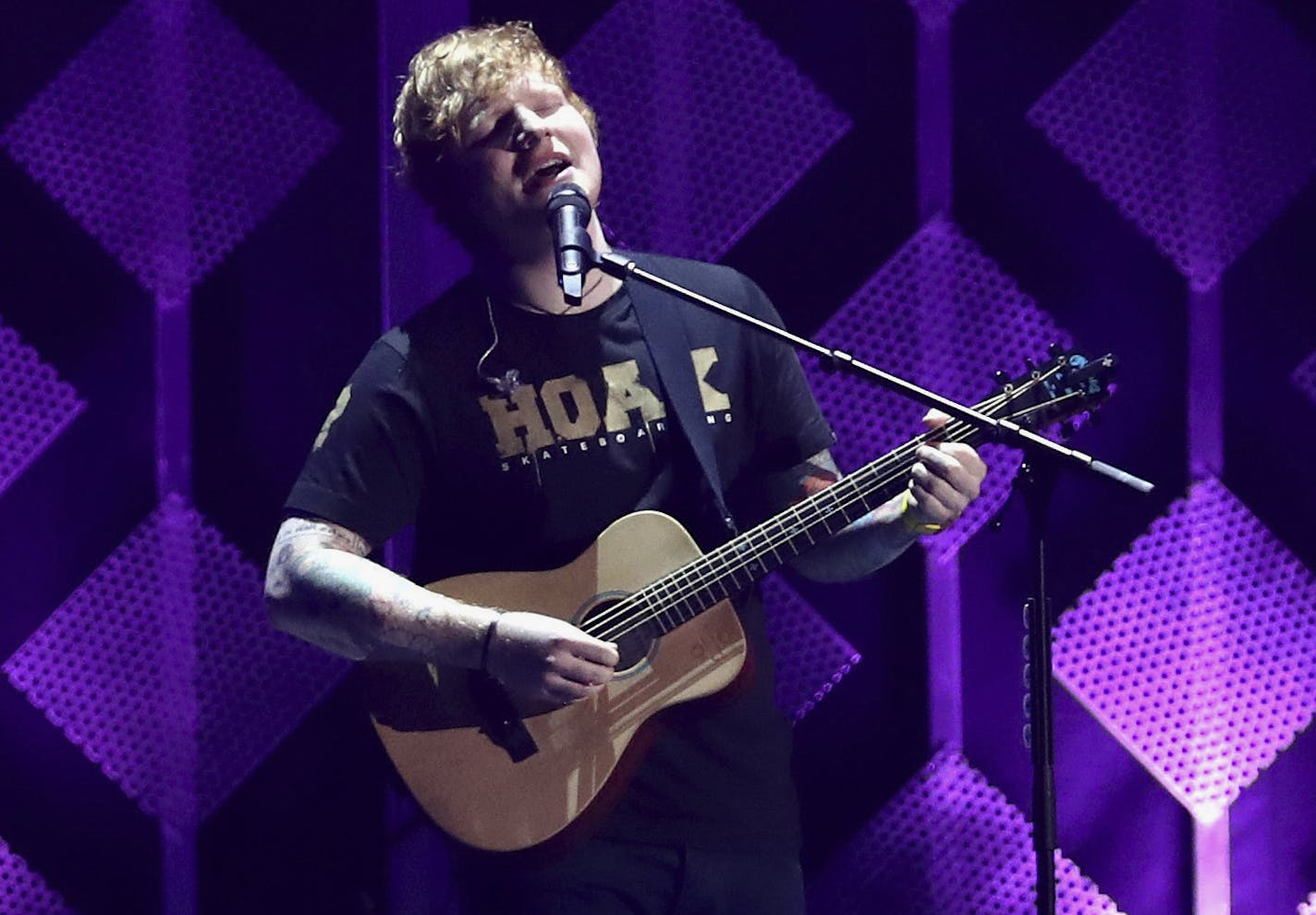 FILE - In this Dec. 1, 2017, file photo, Ed Sheeran performs at Jingle Ball at The Forum in Inglewood, Calif. The Grammys may have dissed Sheeran, but Spotify says he's the most streamed artist of the year. The streaming service announced Tuesday, Dec. 5, that Sheeran tops its 2017 list with 6.3 billion streams. (Photo by John Salangsang/Invision/AP, File)