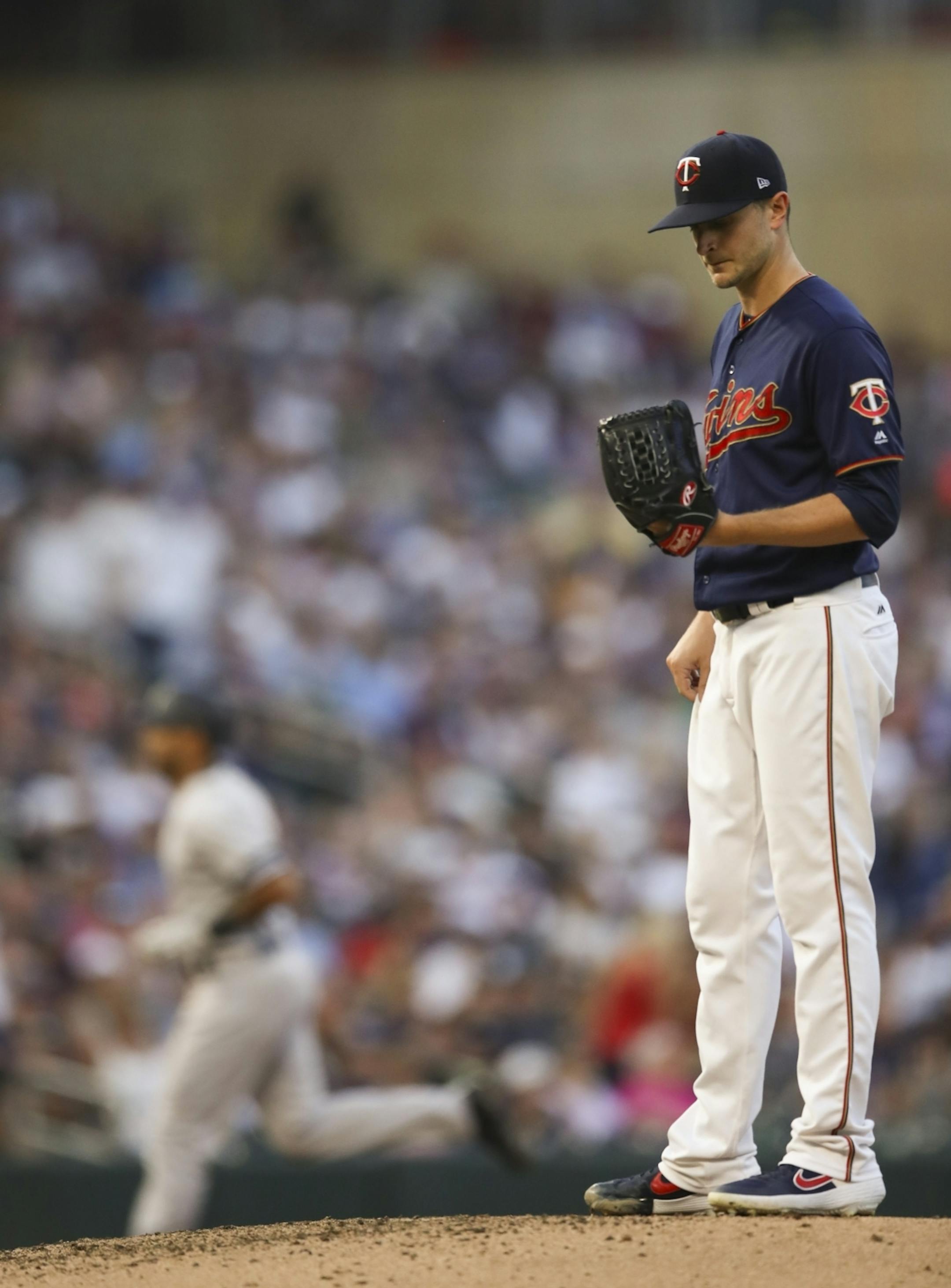 New York Yankees center fielder Aaron Hicks, rear, homered in the third inning off Minnesota Twins starting pitcher Jake Odorizzi (12).