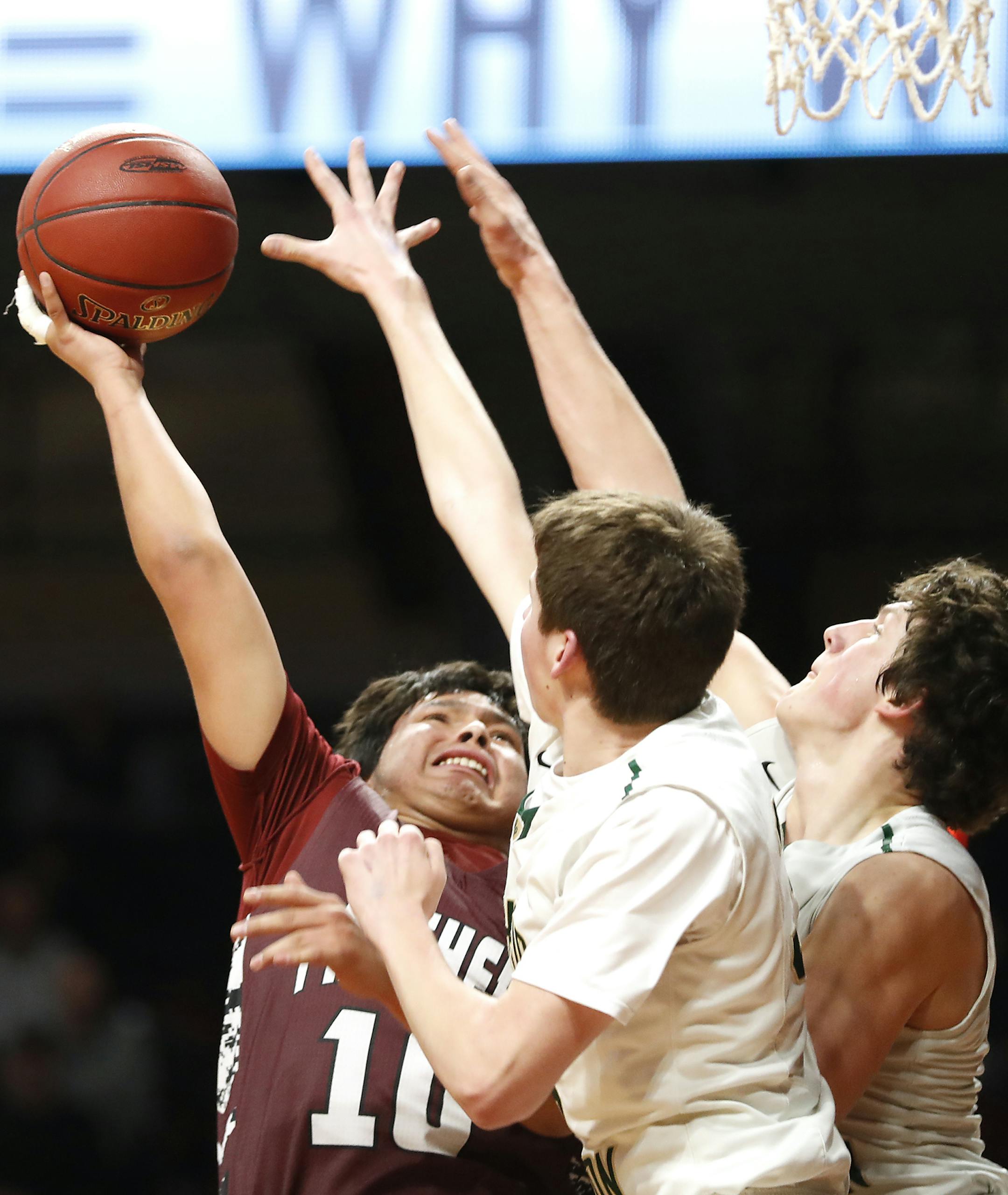 Cass Lake-Bena High School guard Jared Brown (10) shoots as Rushford-Peterson High School guard Luke OHare (35), center, and Rushford-Peterson High School forward Jacob Paulson (13) defend during the first half. ] LEILA NAVIDI ï leila.navidi@startribune.com BACKGROUND INFORMATION: Rushford-Peterson High School plays against Cass Lake-Bena High School in the quarterfinals of the Class A State Boys' Basketball Tournament at Williams Arena in Minneapolis on Thursday, March 22, 2018.