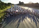 FILE - In this July 9, 2016 file photo, marchers block part of Interstate 94 in St. Paul, Minn., during a protest sparked by the recent police killing