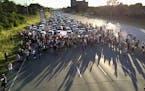 FILE - In this July 9, 2016 file photo, marchers block part of Interstate 94 in St. Paul, Minn., during a protest sparked by the recent police killing
