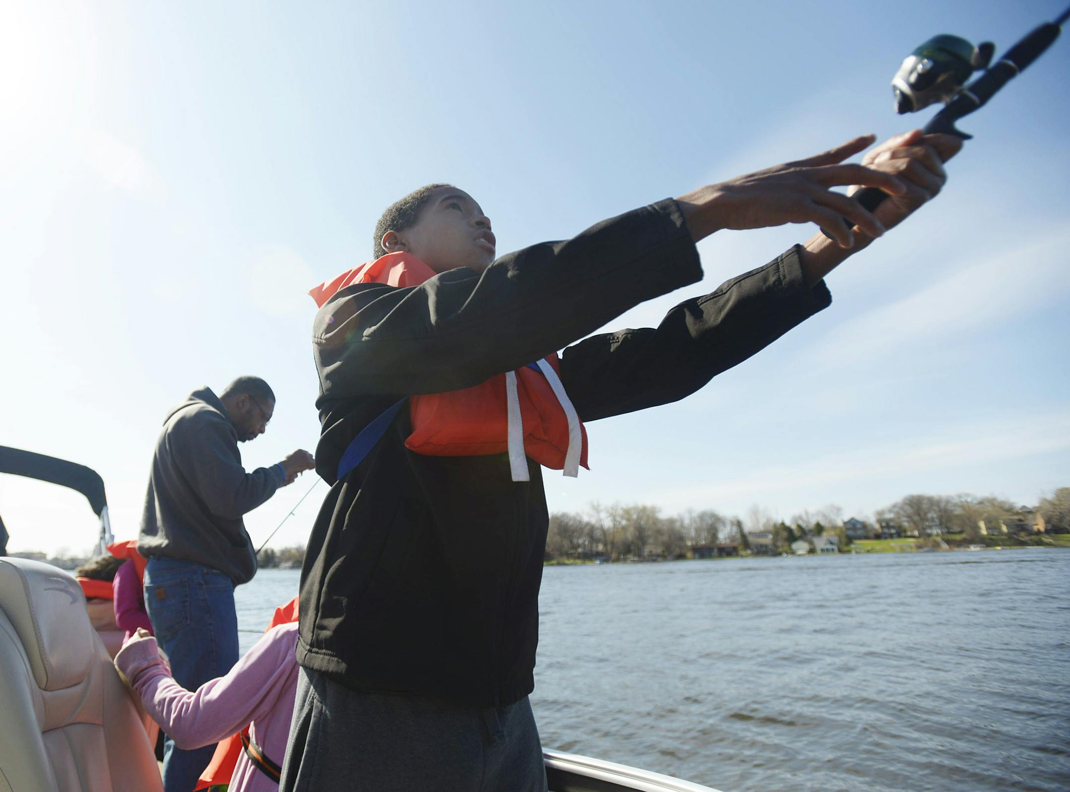 Austin Fields casts his pole as he fishes with his Boys and Girls Club during the 46th annual Minnesota Bounty Crappie Contest on Lake Minnetonka Saturday. ] (AMANDA SNYDER/ Special to the Star Tribune) ORG XMIT: MIN1405031252354664