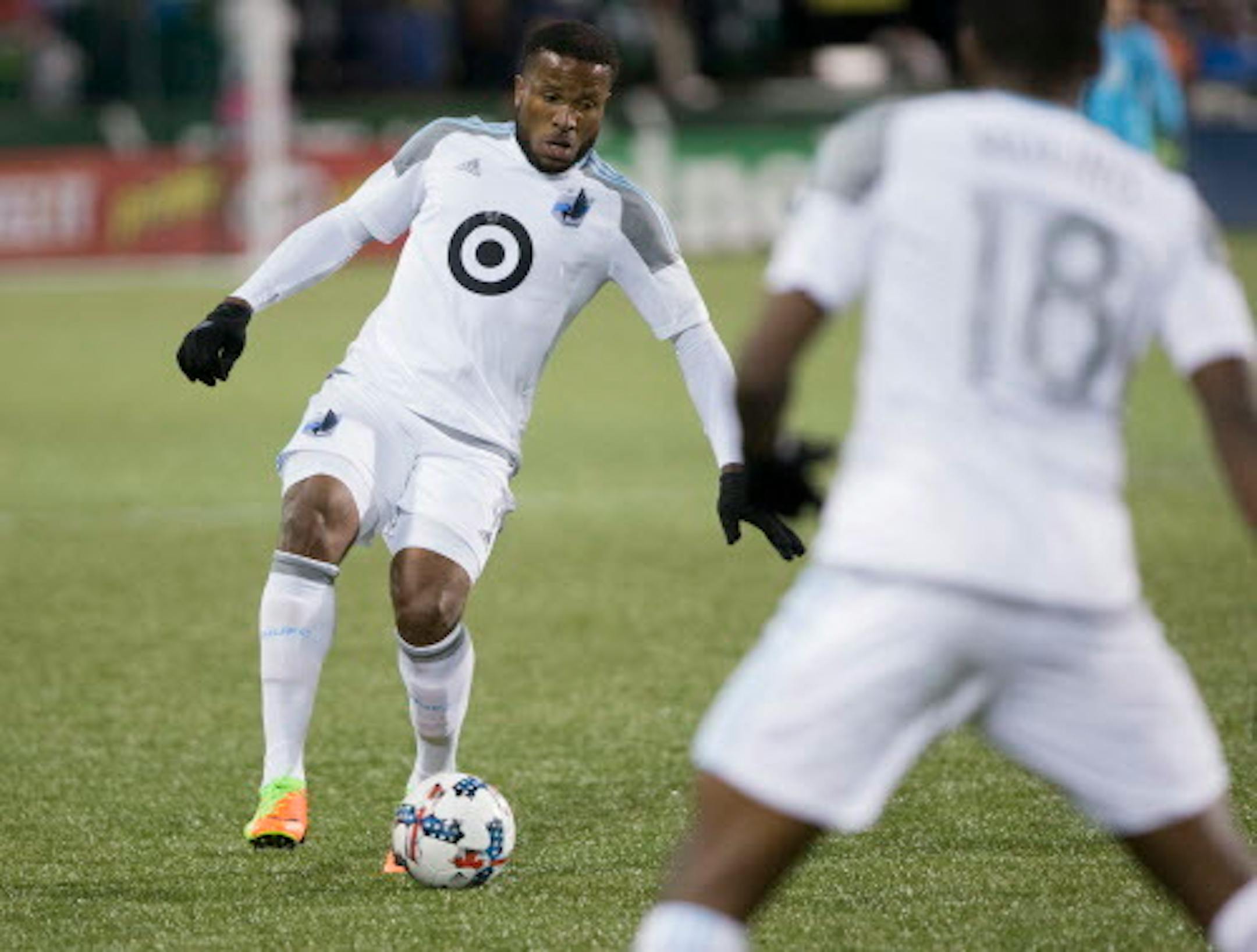 Gloves were in order for Minnesota United defender Jermaine Taylor, right, during a rainy season opener at Portland on March 3. But Sunday's home opener at TCF Bank Stadium has a wintry forecast: a high of 28 and an 80 percent chance of snow.