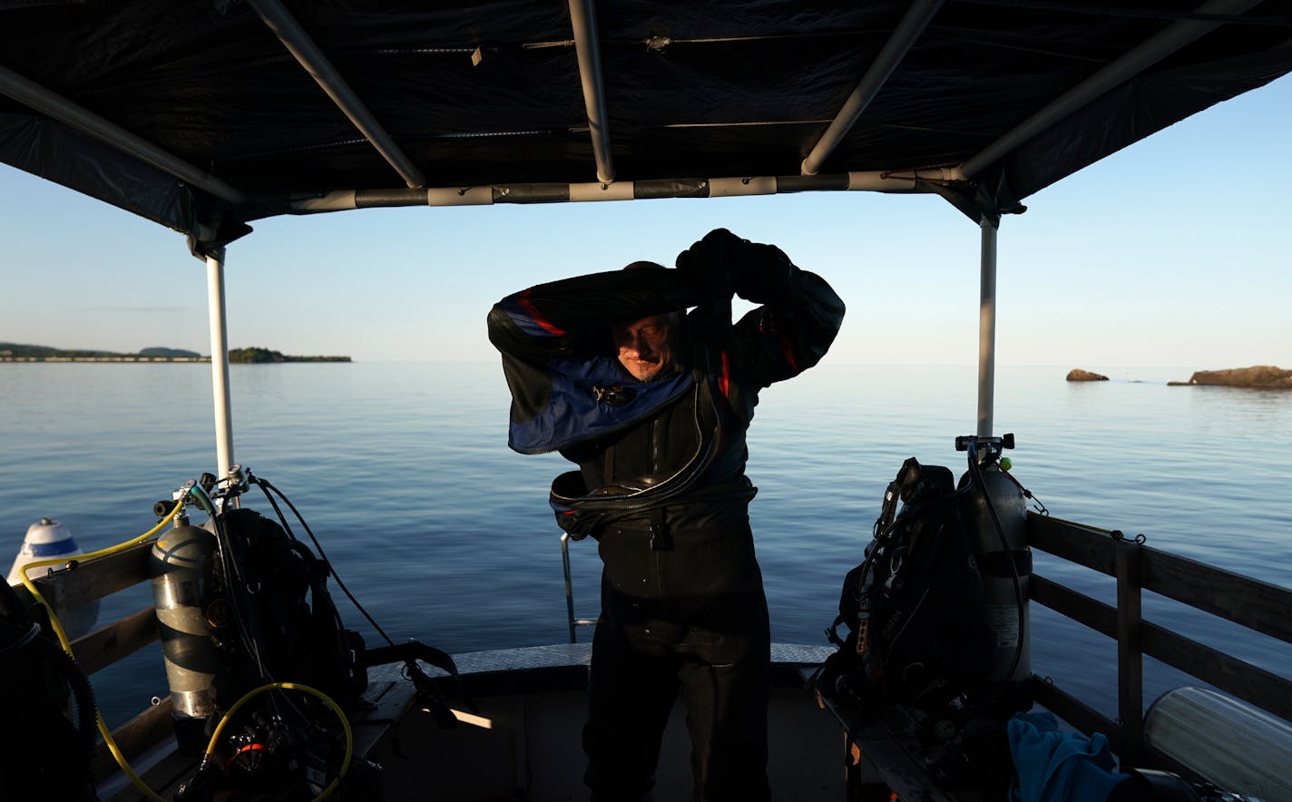 Jack Decker, a diver with the Great Lakes Shipwreck Preservation Society from Clear Lake, Iowa, pulled off his drysuit on the group's boat the RV Preservation after diving the Hesper. ] ANTHONY SOUFFLE &#x2022; anthony.souffle@startribune.com The scuba divers of the Great Lakes Shipwreck Preservation Society dove the two most accessible shipwrecks, the Hesper, a bulk-freighter steamship that sank in Lake Superior on May 4, 1905 off Silver Bay and the Madeira, a schooner barge that sank in Lake S