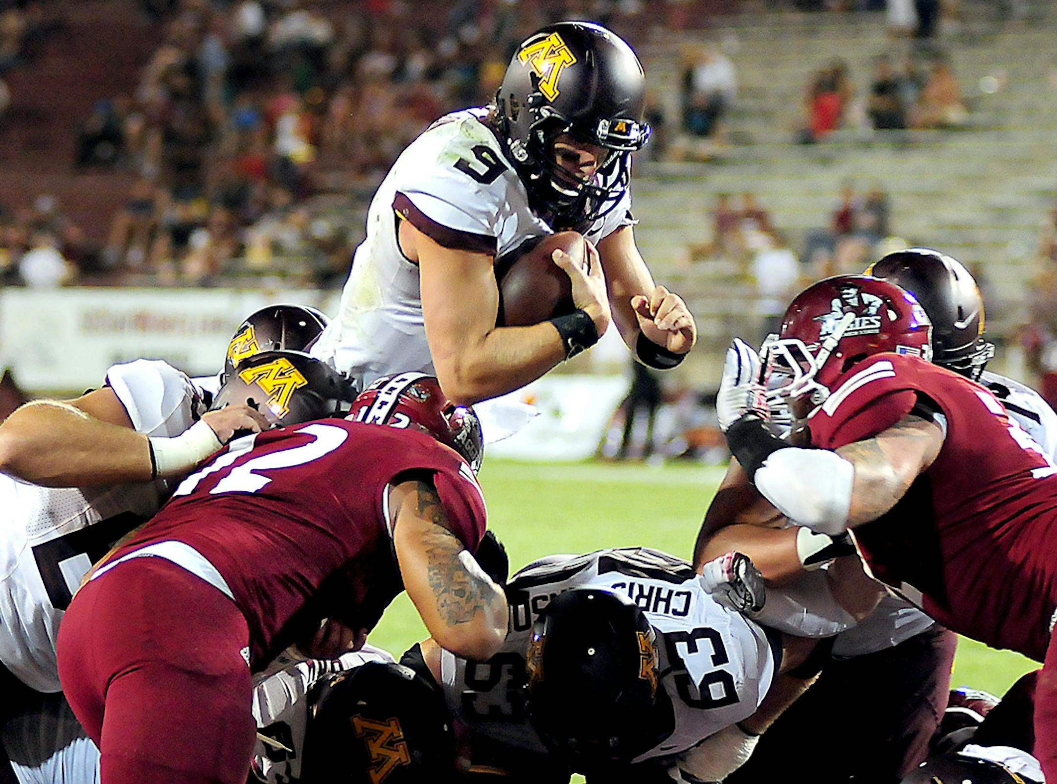 Gopher quarterback Philip Nelson soars over the New Mexico State defensive line and into the end zone Saturday during the second half of the game at Aggie Memorial Stadium in Las Cruces, N.M