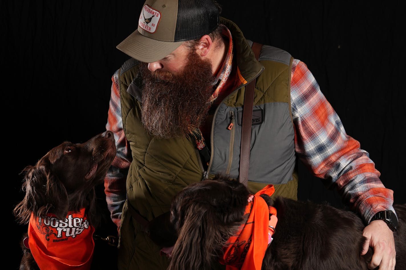 Matt Bathke of Spirit Lake, Iowa looks to his dog Amara, a 3-year-old Deutsch Langhaar, as they sit for a portrait ahead of the Bird Dog Parade during the National Pheasant Fest &amp; Quail Classic Friday, Feb. 17, 2023 at the Minneapolis Convention Center in Minneapolis. ] ANTHONY SOUFFLE • anthony.souffle@startribune.com