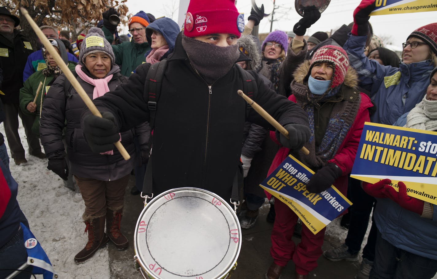 At the Walmart near the intersection of Snelling and University in St. Paul, protesters including Julio Fernandez, who was beating the drum for better wages and working conditions from the giant retailer. ] Richard Tsong-Taatarii/ rtsong- taatarii@startribune.com