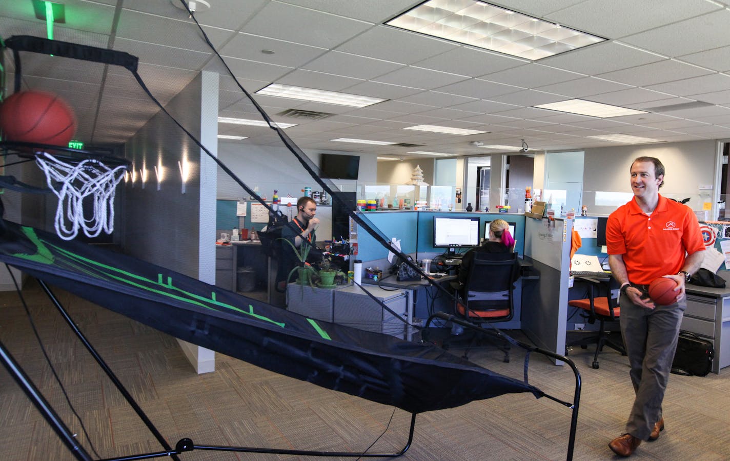 Jason DaCosta, vp of customer operations, was shooting the basketball at the basketball game machine on the 22nd floor. ] XAVIER WANG &#x2022; xavier.wang@startribune.com Employees in the home security company ALARM.COM use and live in the office space in a creative and fun way, which makes the office doesn't resemble the traditional call center. The photos were taken on Thursday June 1, 2017 in Bloomington.