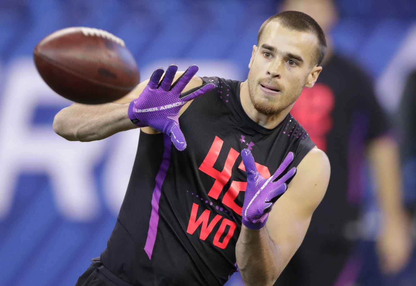 South Dakota State wide receiver Jake Wieneke runs a drill at the NFL football scouting combine in Indianapolis, Saturday, March 3, 2018. (AP Photo/Michael Conroy) ORG XMIT: INMC10