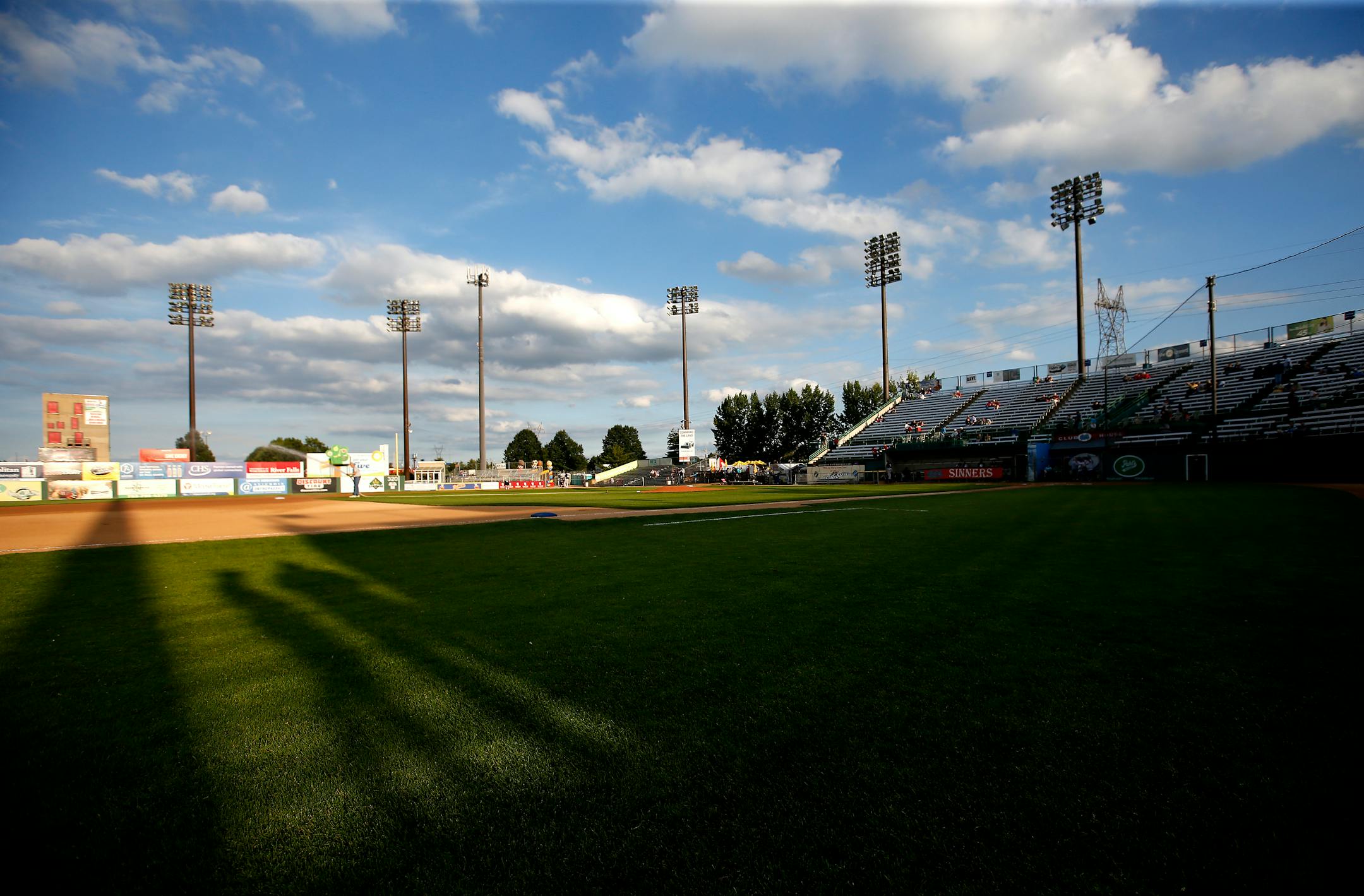 Fans in the stands at Midway Stadium cast a shadow on the field as the grounds crew prepared the field for Wednesday night's game, the second-to-last at the St. Paul ballpark.